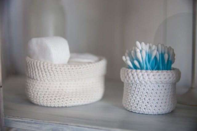 Knitted cleaning baskets to organize Airbnb cleaning supplies