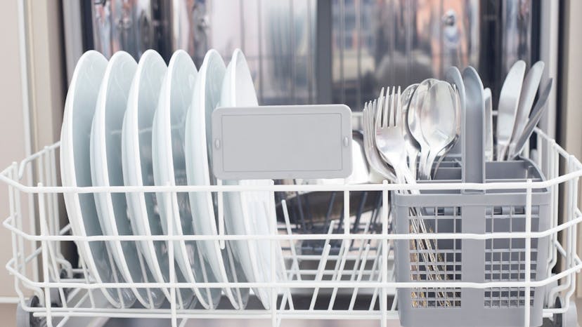 Dishes in an Airbnb's dishwasher with the silverware separated