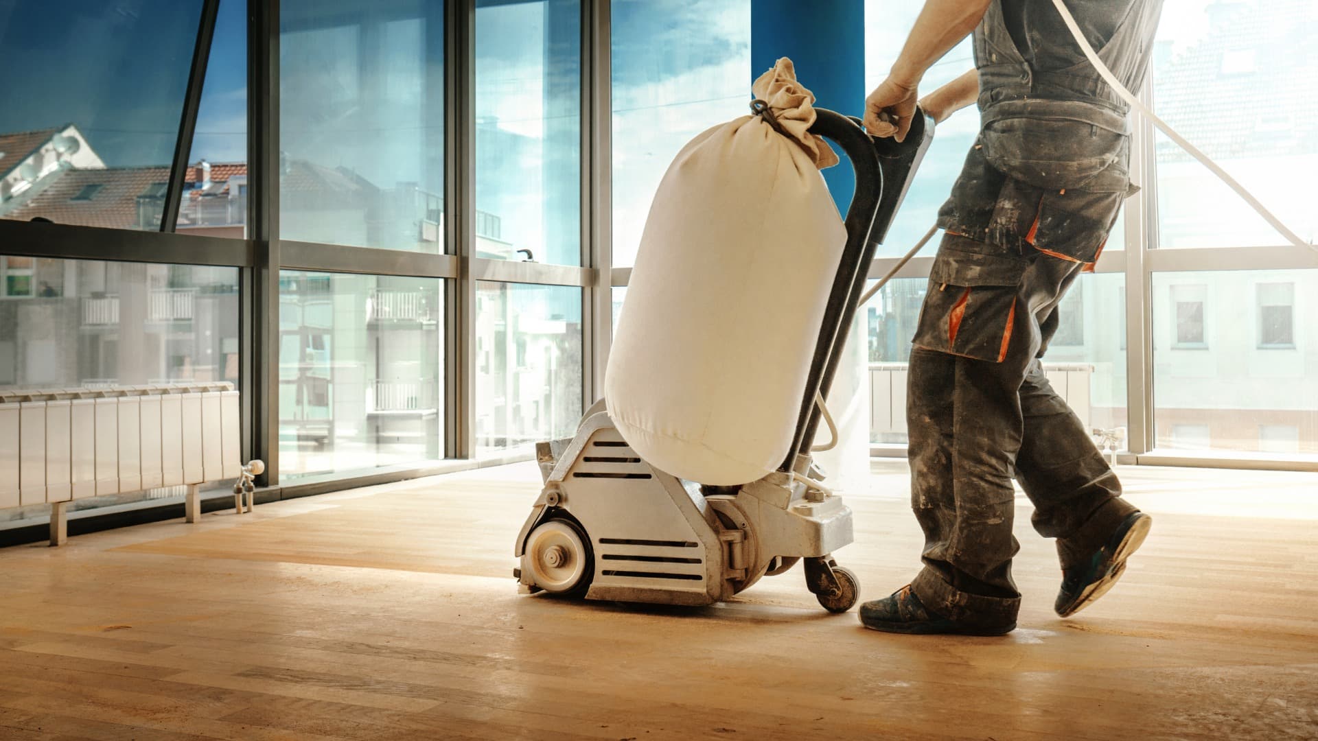 Male cleaning hardwood floors