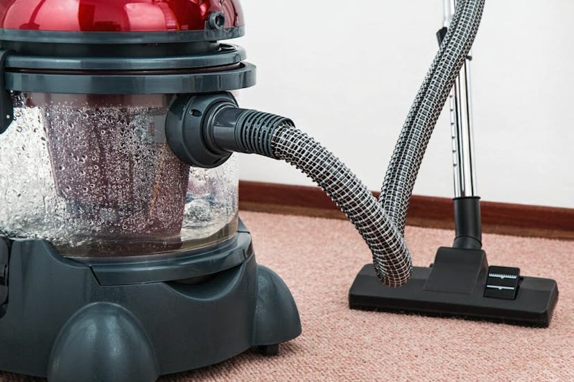 Wet vacuum with dirty water in tank.